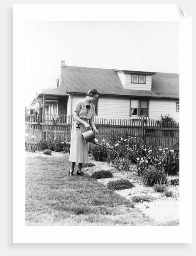 Woman watering garden with water can by Anonymous