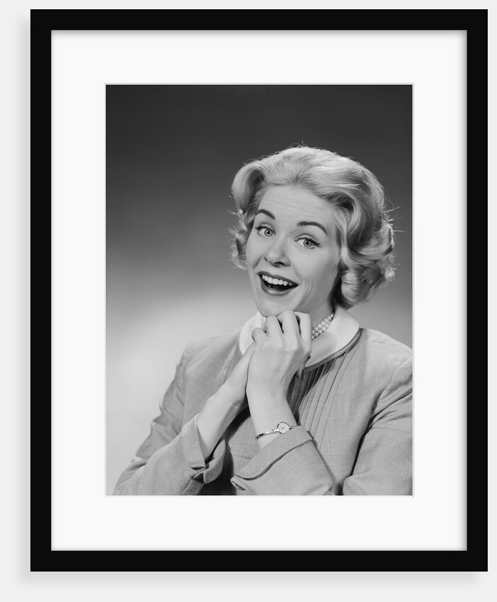 Woman clasped hand by chin with wishful hoping happy joyful facial expression by Anonymous