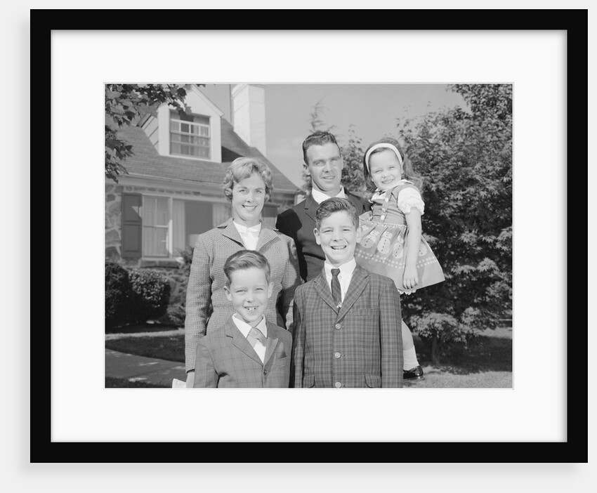 Family portrait father mother two sons and daughter in front of suburban house by Anonymous