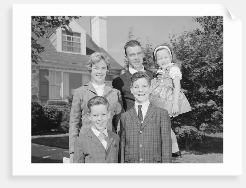Family portrait father mother two sons and daughter in front of suburban house by Anonymous