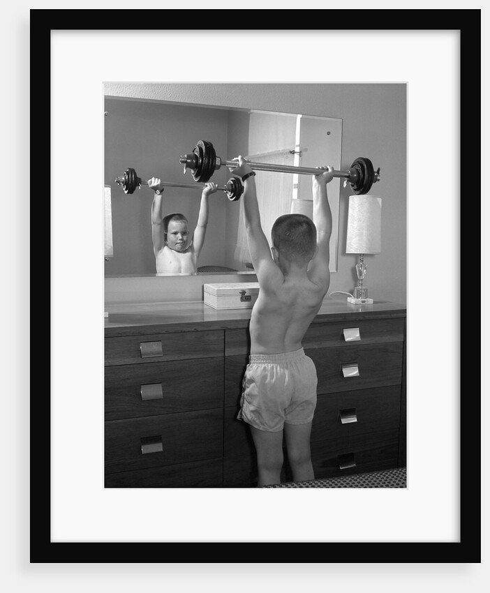Boy exercising with dumbbell at mirror in bedroom by Anonymous