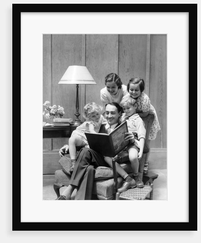 Father reading to family in chair by Anonymous