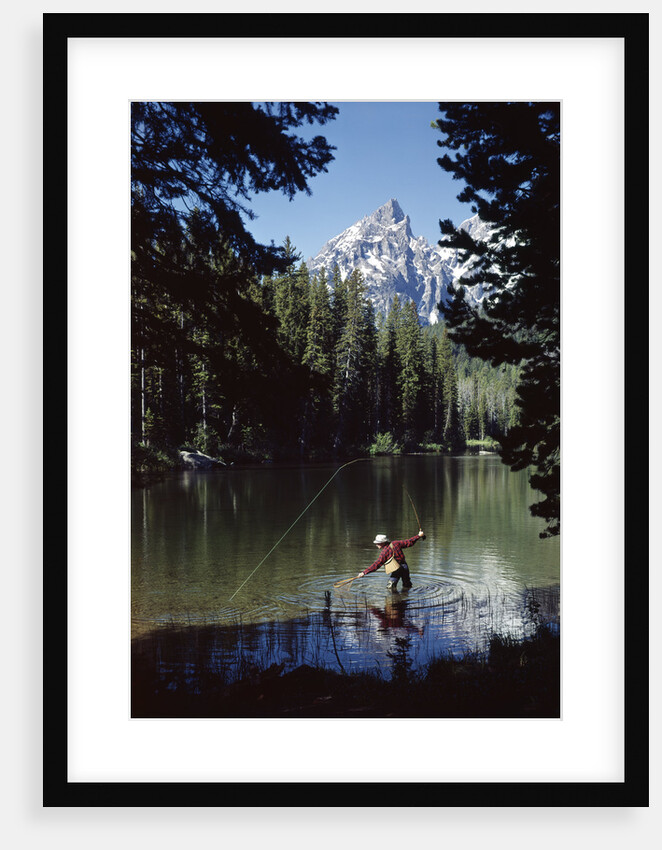 Man fishing at string lake grand teton national park wyoming by Anonymous