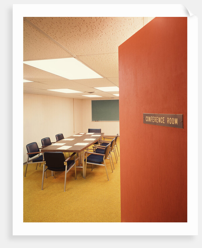 Conference room interior with table chairs chalkboard open door ajar by Anonymous