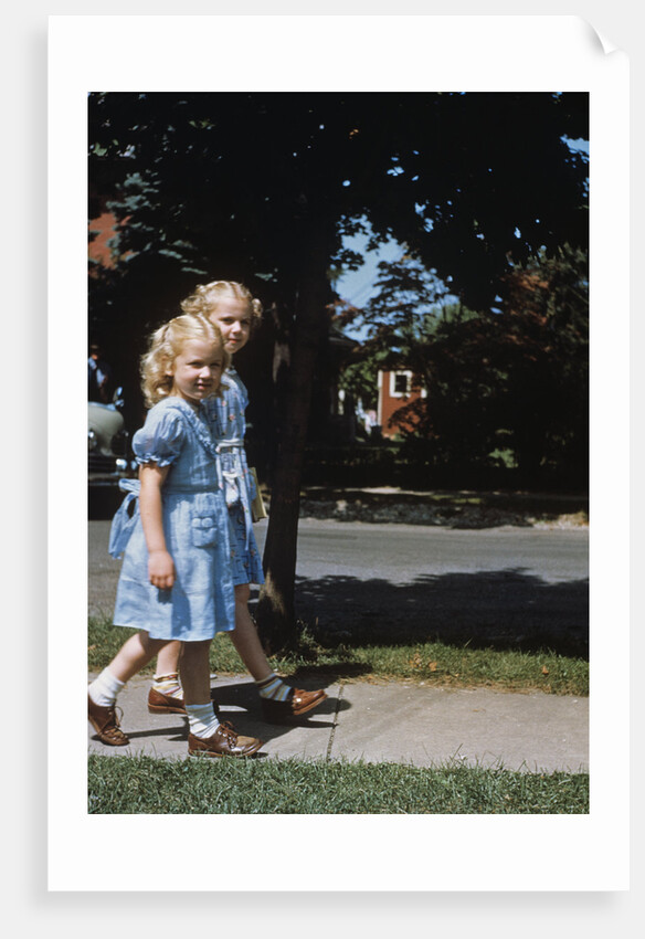 Two blond girls wearing blue dresses on the first day of school by Anonymous