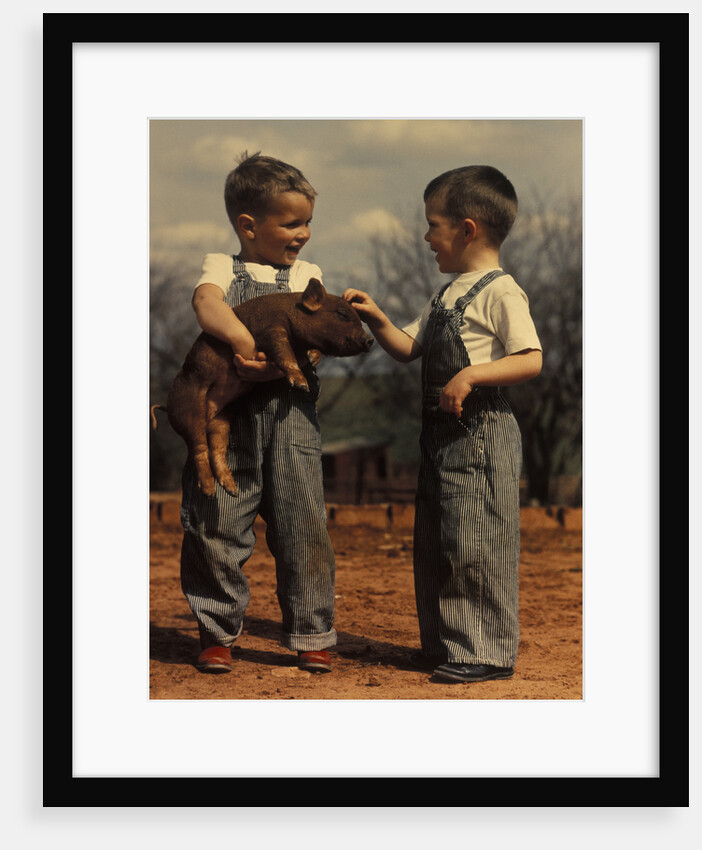 Two small boys bib overalls with piglet by Anonymous