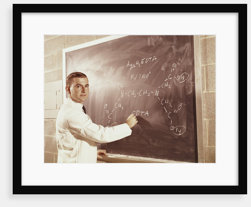 Science professor writing a formula for chelating agent on chalkboard by Anonymous