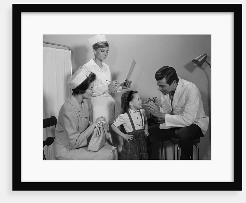 Mother sitting watching man pediatric doctor woman nurse checking on smiling little girl patient by Anonymous