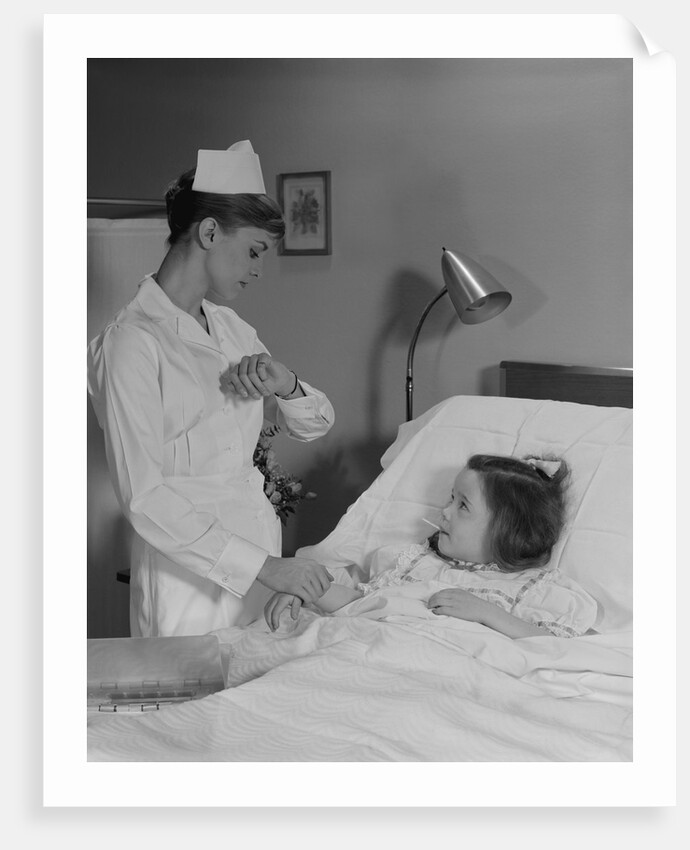 Woman nurse checking pulse taking temperature on little girl patient in hospital bed by Anonymous