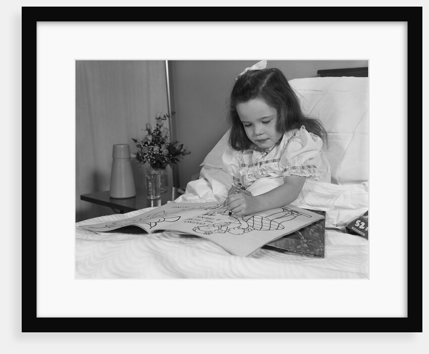 Little girl patient in hospital bed writing in coloring book by Anonymous