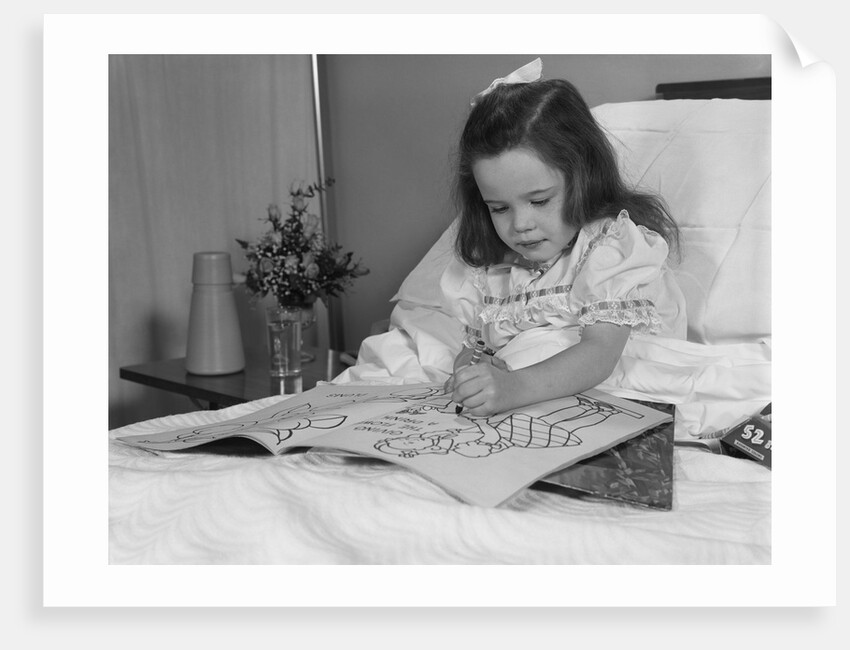 Little girl patient in hospital bed writing in coloring book by Anonymous