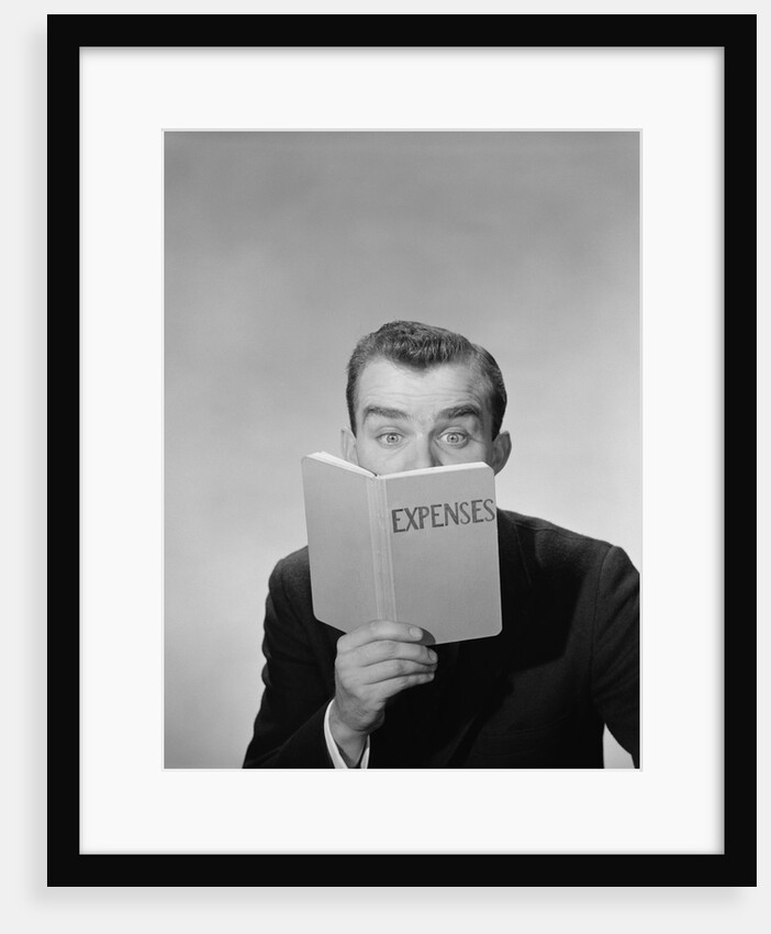 Man wide open eyes looking into expenses book hiding his lower face by Anonymous