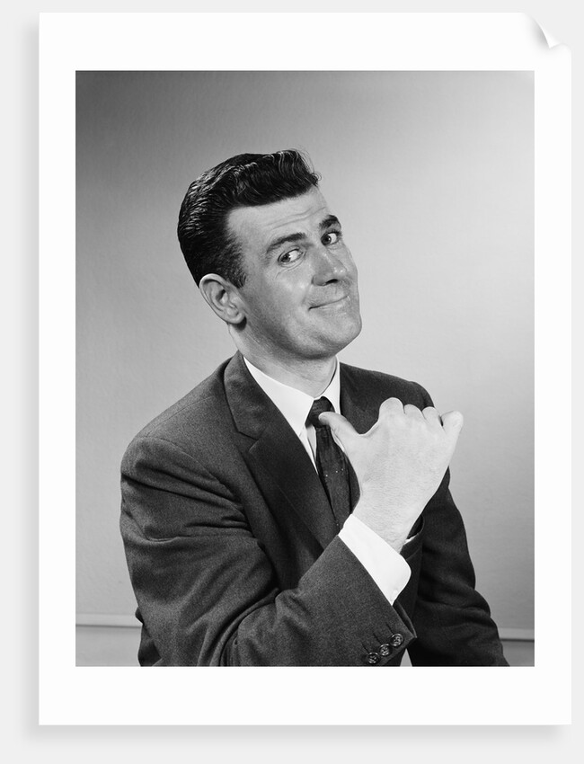 Business man smiling giving thumbs up sign pointing to himself by Anonymous