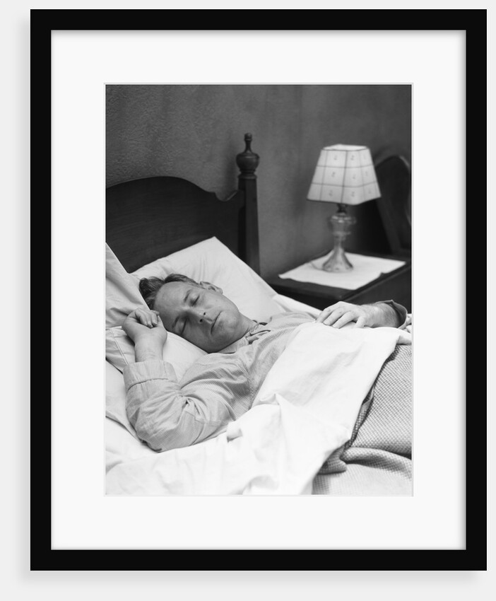 Man sleeping asleep in bedroom by Anonymous