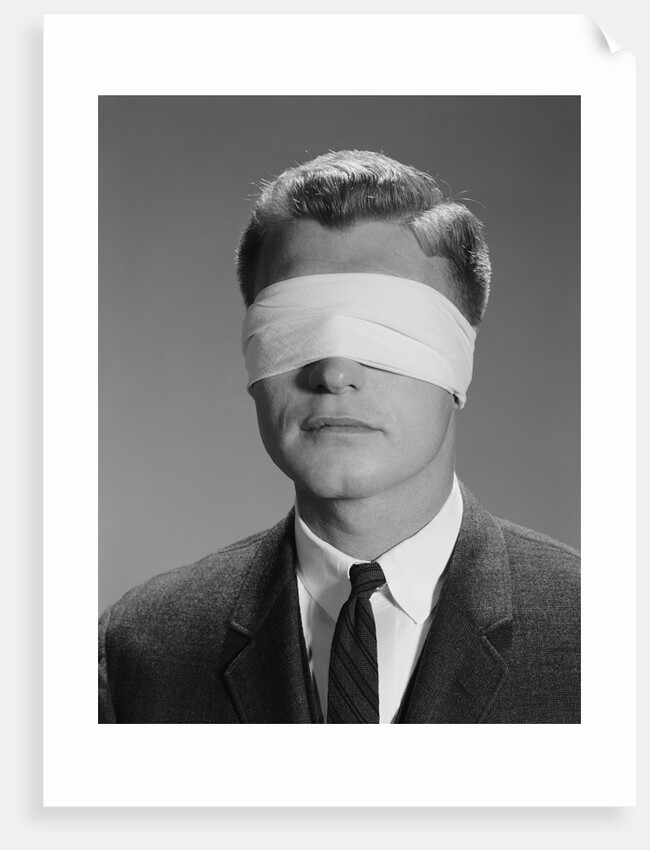 Young man wearing blindfold by Anonymous