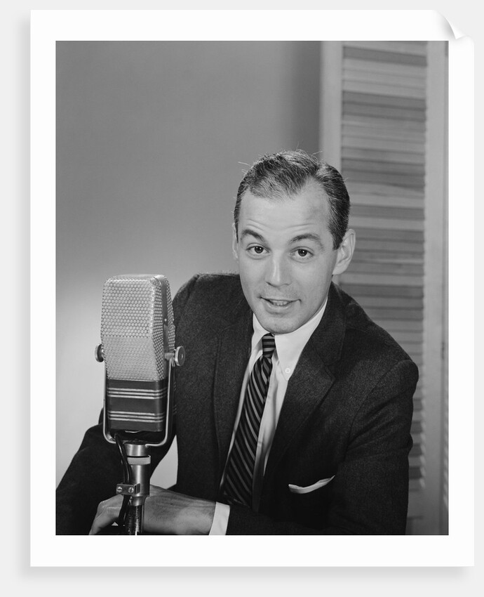 Man speaking into microphone radio tv announcer broadcaster by Anonymous