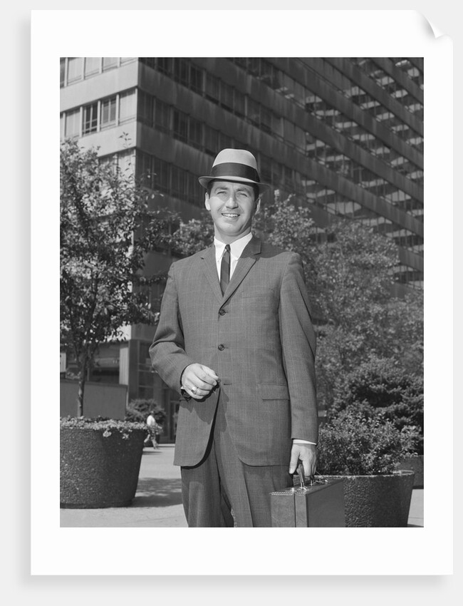 Portrait businessman wearing hat suit holding briefcase by Anonymous