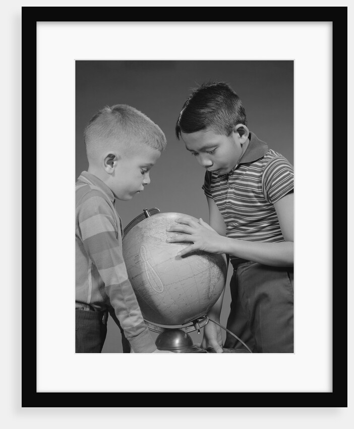 Two boys studying earth globe by Anonymous
