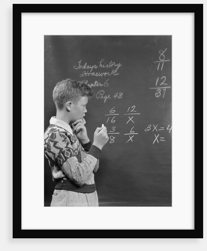 Boy at blackboard doing math multiplication problem by Anonymous