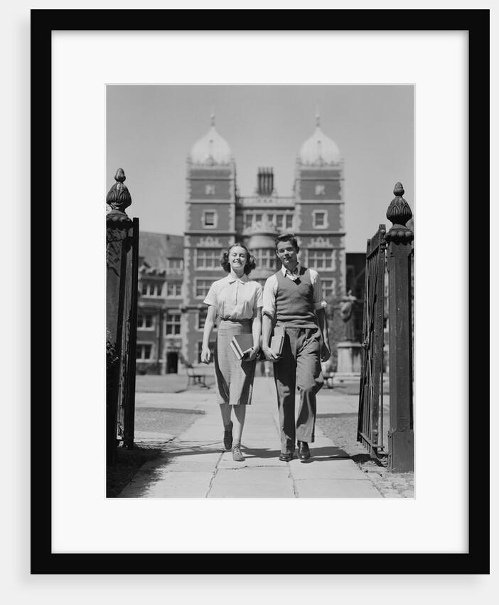 College aged student couple walking through campus gates university of pennsylvania by Anonymous