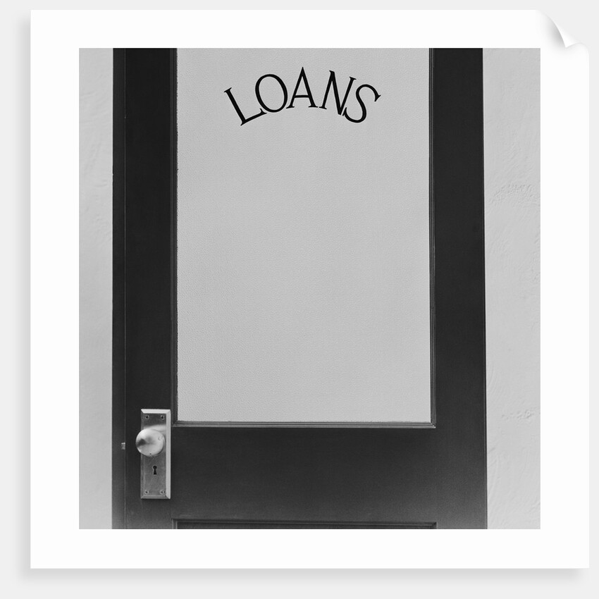 Office door glass panel with sign loans by Anonymous