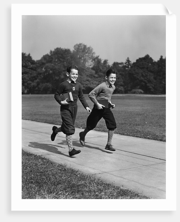Two smiling boys running carrying school books by Anonymous