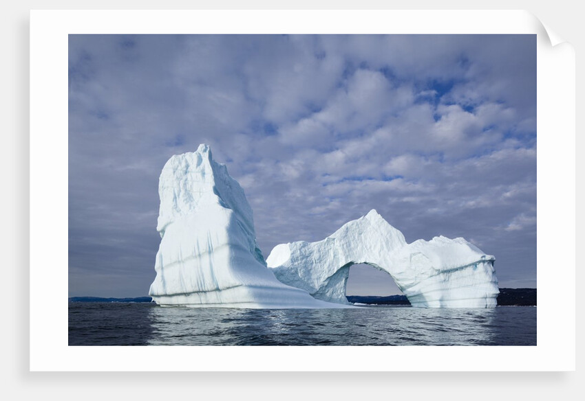 Arched iceberg in Disko Bay in Greenland by Anonymous