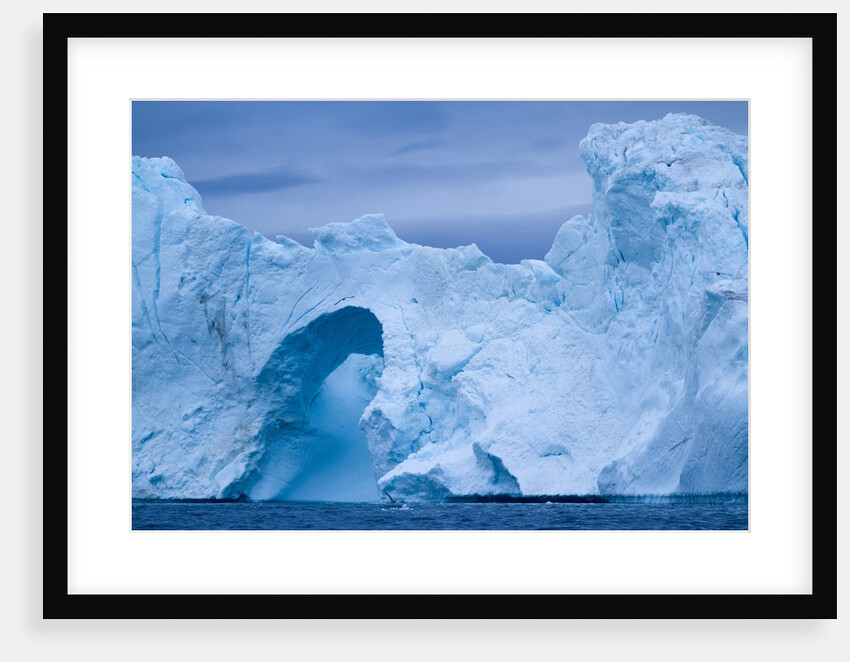Hole melted in iceberg in Disko Bay in Greenland by Anonymous