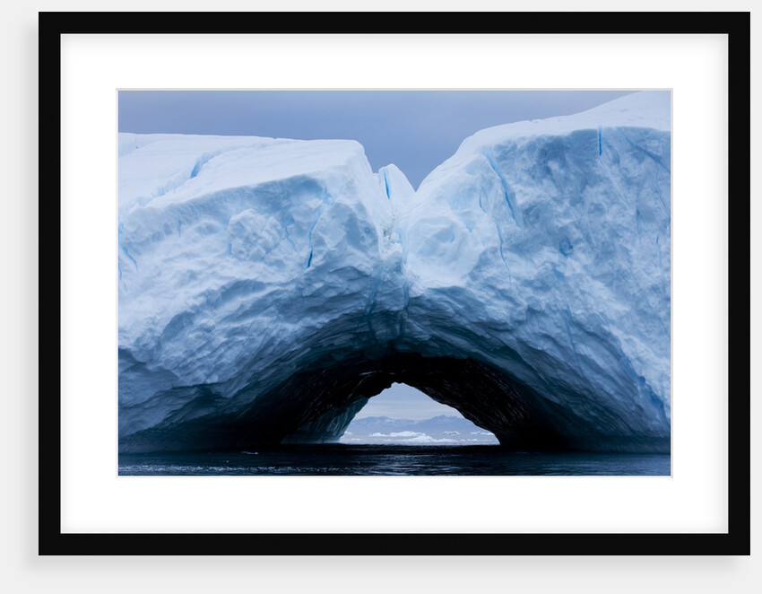 Arched iceberg in Disko Bay in Greenland by Anonymous