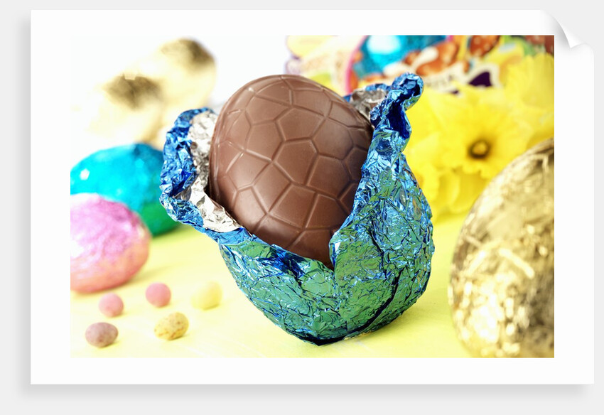 Chocolate Easter egg with opened foil by Anonymous