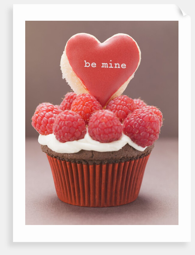 Chocolate cupcake with raspberries & heart-shaped biscuit by Anonymous