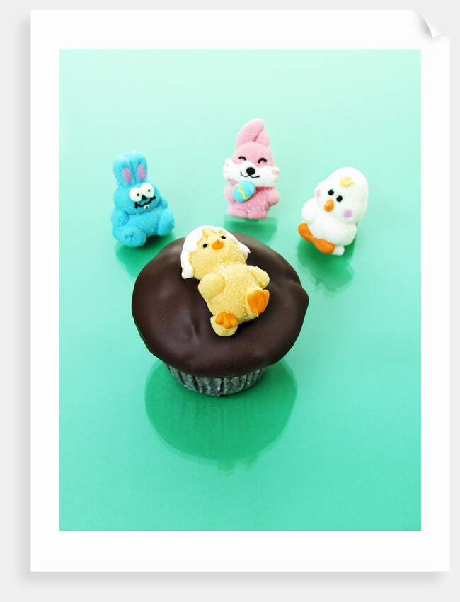 Muffin with chocolate icing and jelly chick for Easter by Anonymous