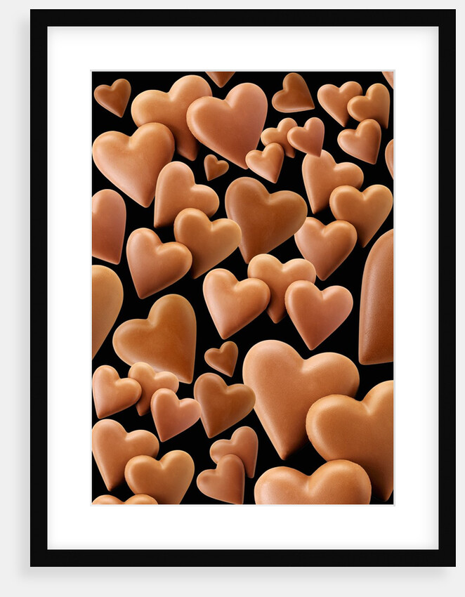Chocolate hearts, black background by Anonymous