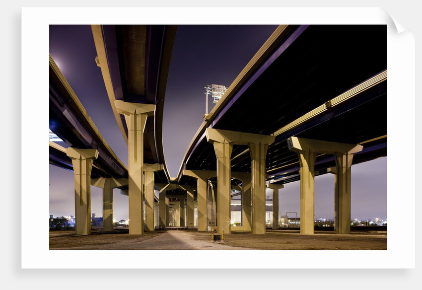 Highway overpasses at night by Anonymous