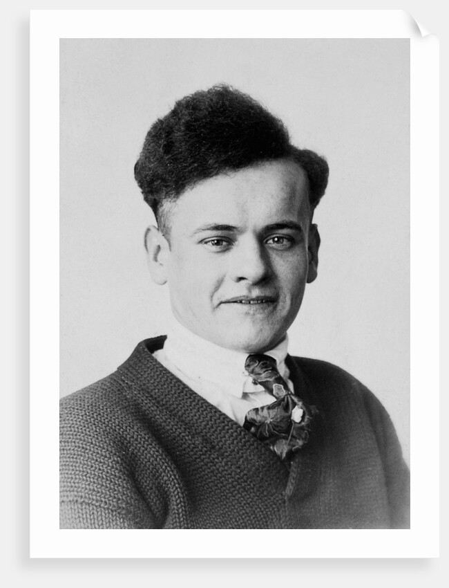 Young man smiles in a formal portrait, ca. 1920 by Anonymous
