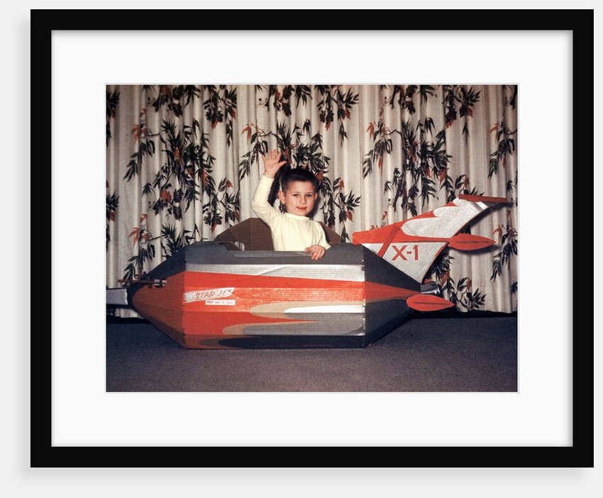 Young boy plays in a cardboard rocketship, ca. 1956 by Anonymous