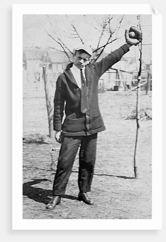 Teenage boy plays catch, ca. 1912 by Anonymous