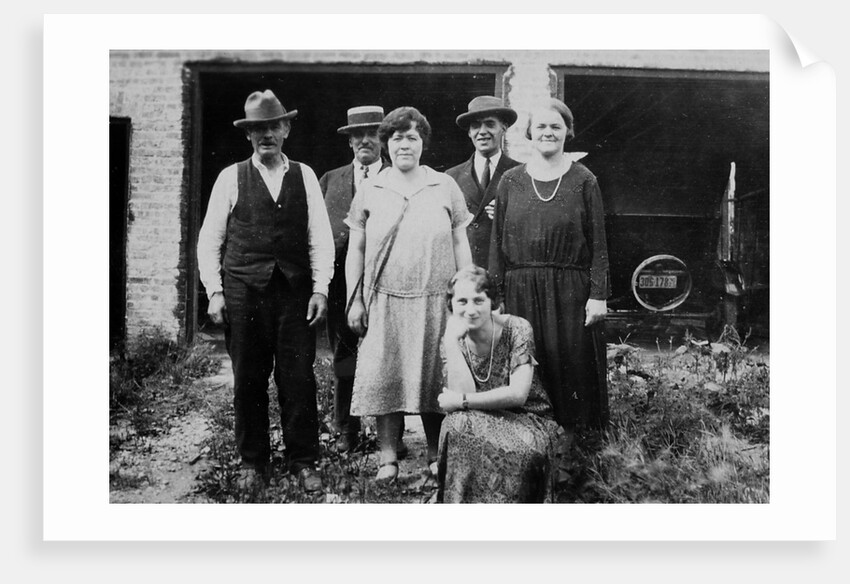 Family standing in front of garage, ca. 1925 by Anonymous