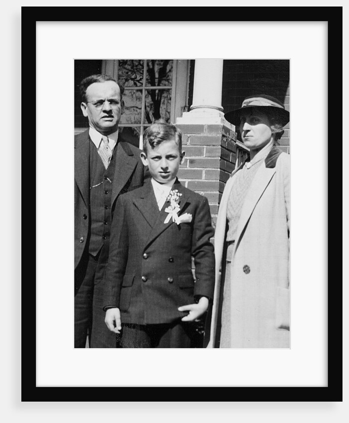 Young boy with his stern looking parents, ca. 1935 by Anonymous