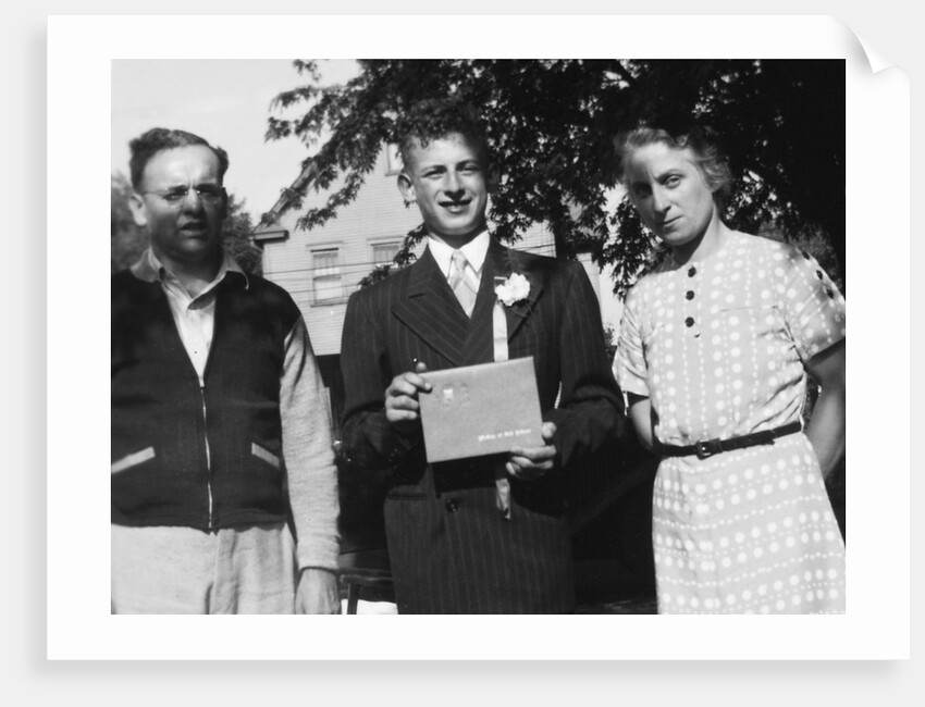 Boy with his parents on his 8th grade graduation, ca. 1940 by Anonymous