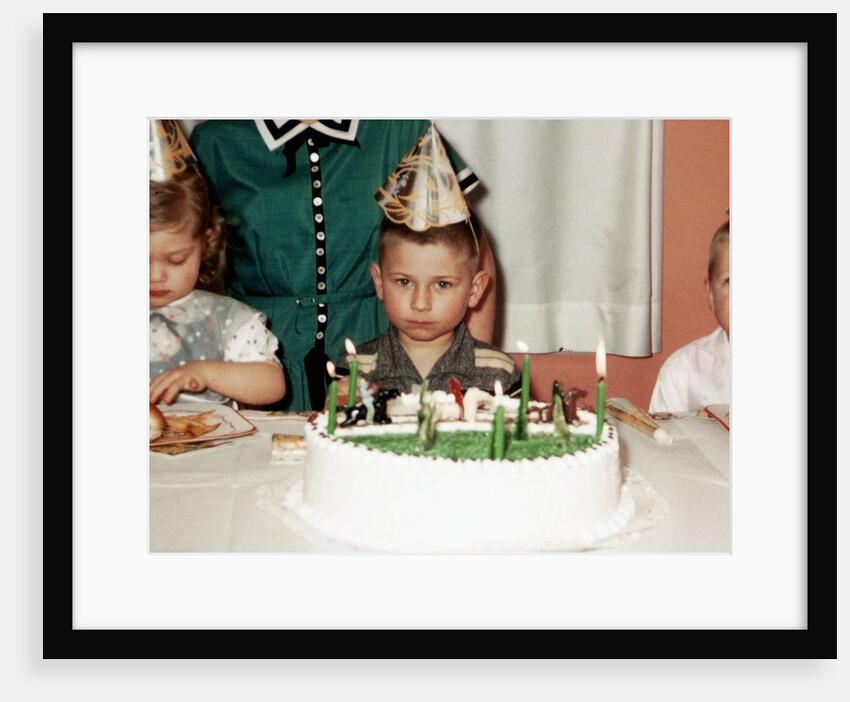 Grumpy boy at fifth birthday party, ca. 1957 by Anonymous