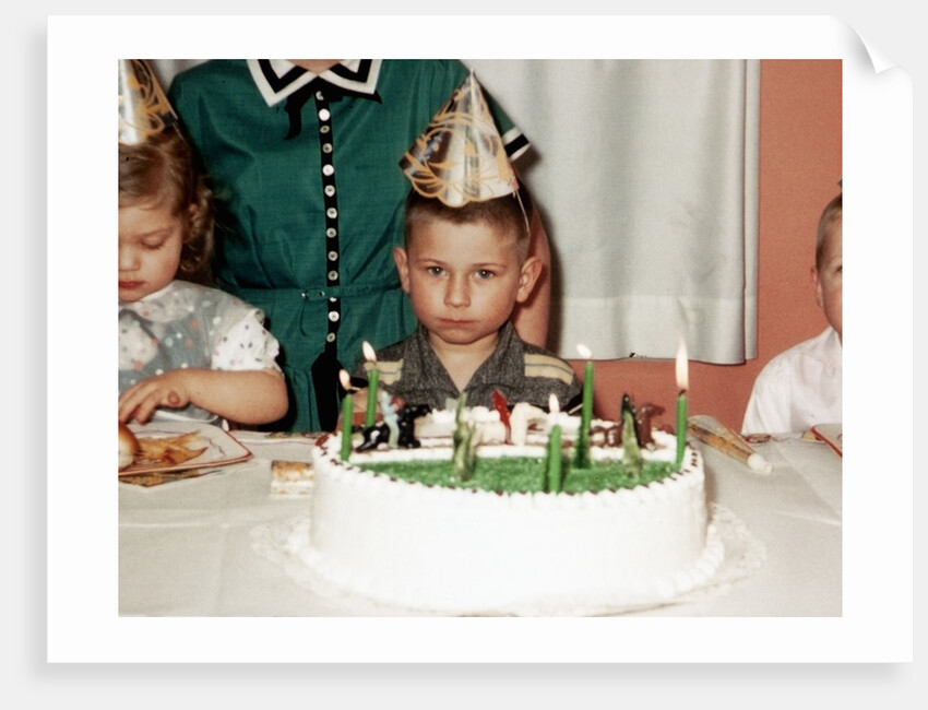 Grumpy boy at fifth birthday party, ca. 1957 by Anonymous