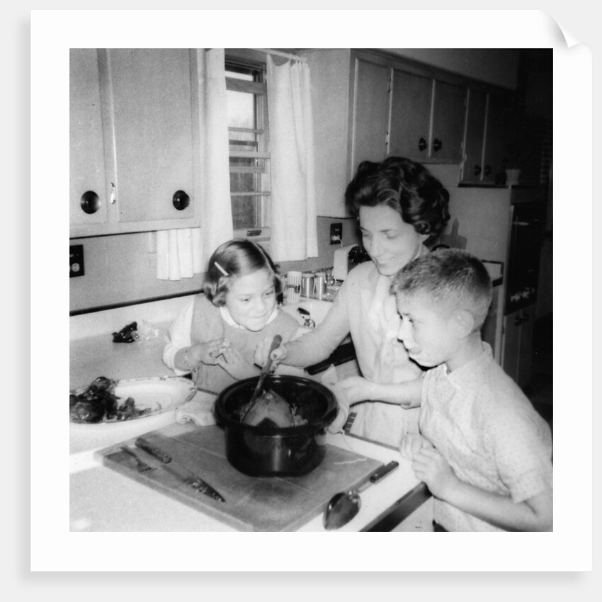Mom prepares dinner with the kids watching, ca. 1962 by Anonymous