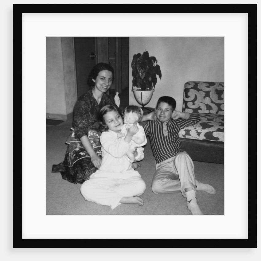 Mother with son and daughter in living room, ca. 1960 by Anonymous