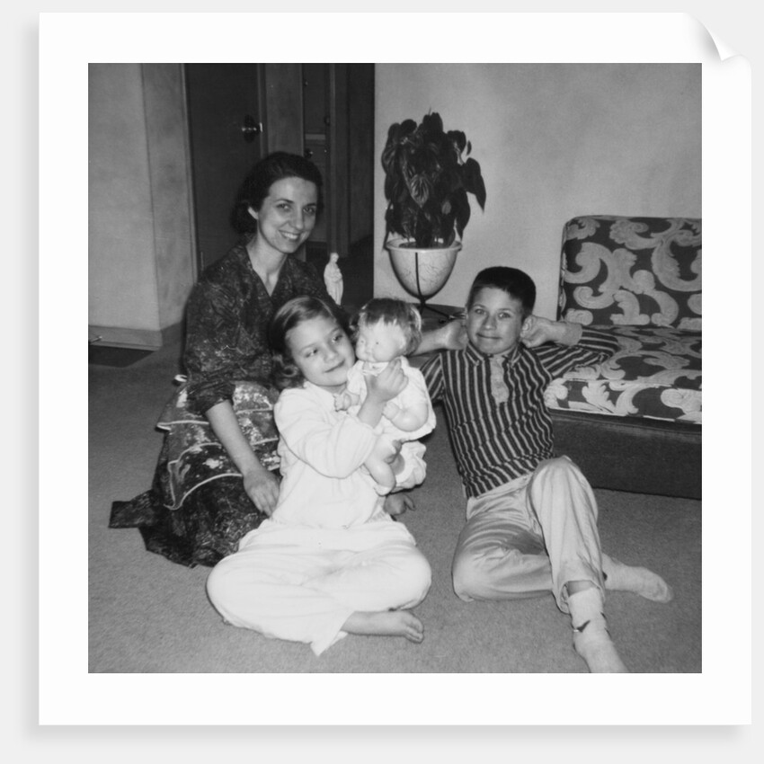 Mother with son and daughter in living room, ca. 1960 by Anonymous