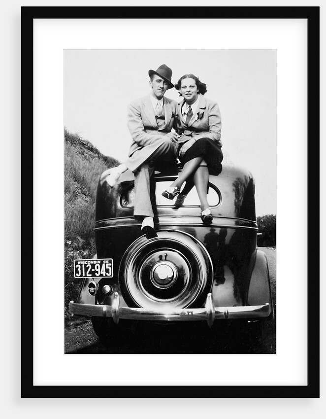 Couple proudly sits on their new car, ca. 1935 by Anonymous