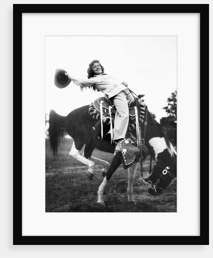 Young woman on phony pony, ca. 1940 by Anonymous