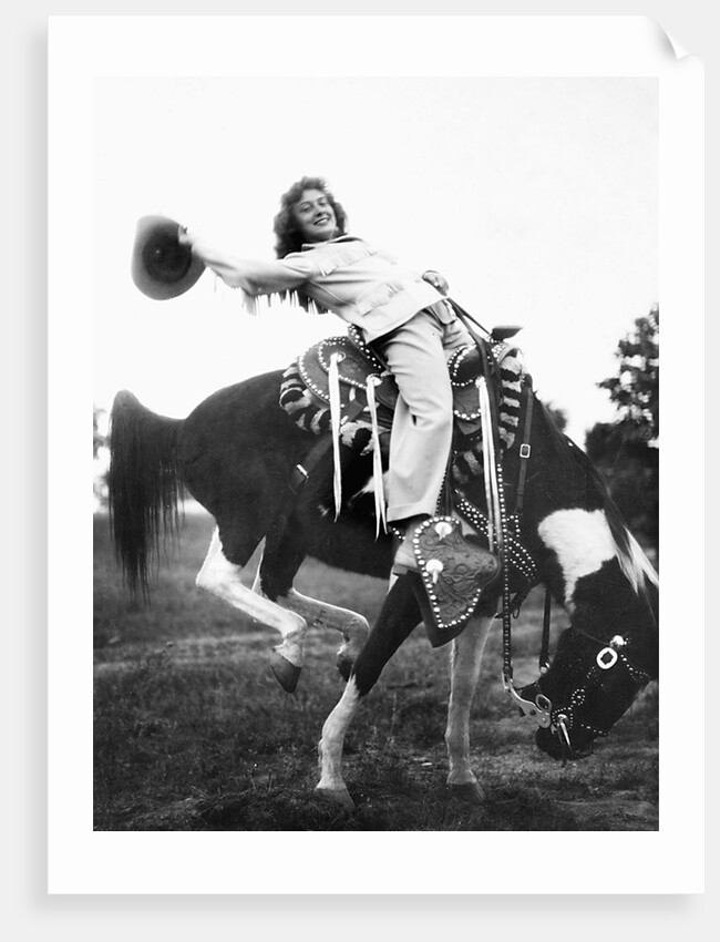 Young woman on phony pony, ca. 1940 by Anonymous