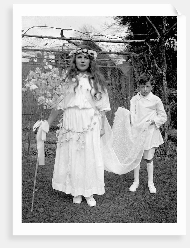 Young girl and attending young boy, ca. 1900. by Anonymous