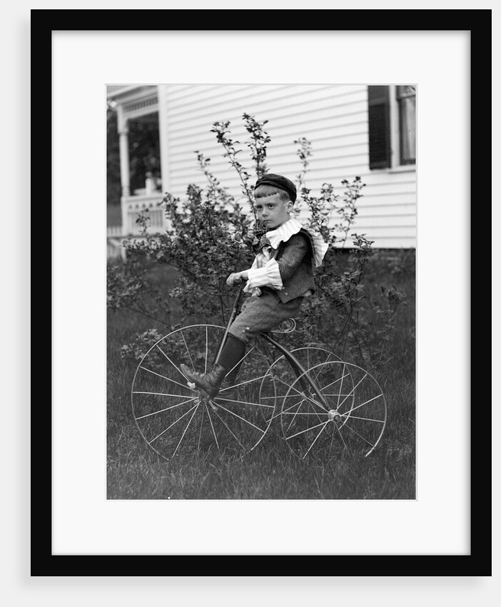 Toddler on a period tricycle, ca. 1895. by Anonymous